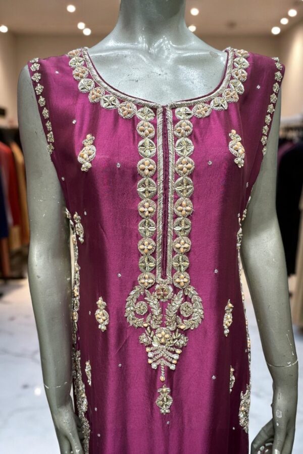 Woman wearing Sukaina Nur handcrafted festive outfit in soft silk and traditional embroidery, perfect for wedding events
